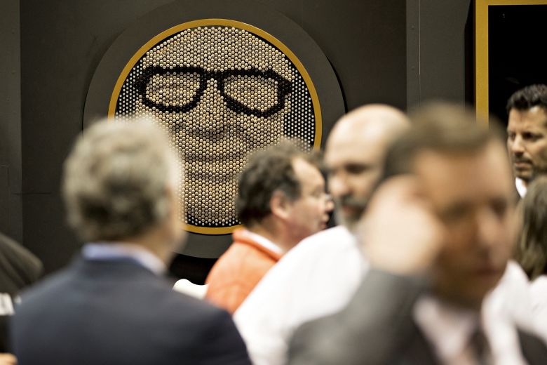 Attendees pass a likeness of Warren Buffett made entirely of Duracell batteries displayed during a shareholders shopping day ahead of the Berkshire Hathaway annual meeting in 2017.