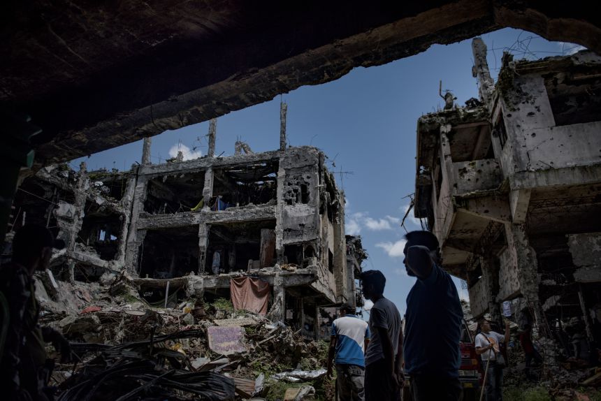 Marawi residents return to their homes in what used to be the main battle area during the war, on May 10, 2018 in Marawi, Philippines.