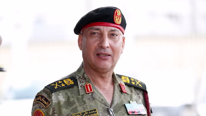 Gen. Muhammad Ali Ahmad al-Haddad wears a military uniform and beret with insignia, posing for a photo.