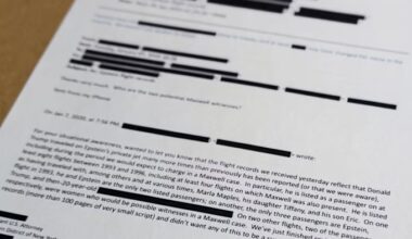A printed email with numerous redactions is shown close up; the text discusses Jeffrey Epstein and related flight records