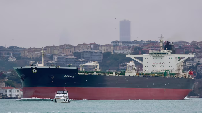 The oil tanker Dashan sails through the Bosphorus with Istanbul’s cityscape in the background.