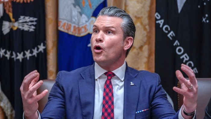 US secretary of defence Pete Hegseth gestures with both hands while answering a question during a Cabinet meeting.