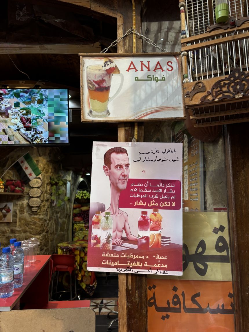 A poster in Damascus mocking ousted President Bashar al-Assad.