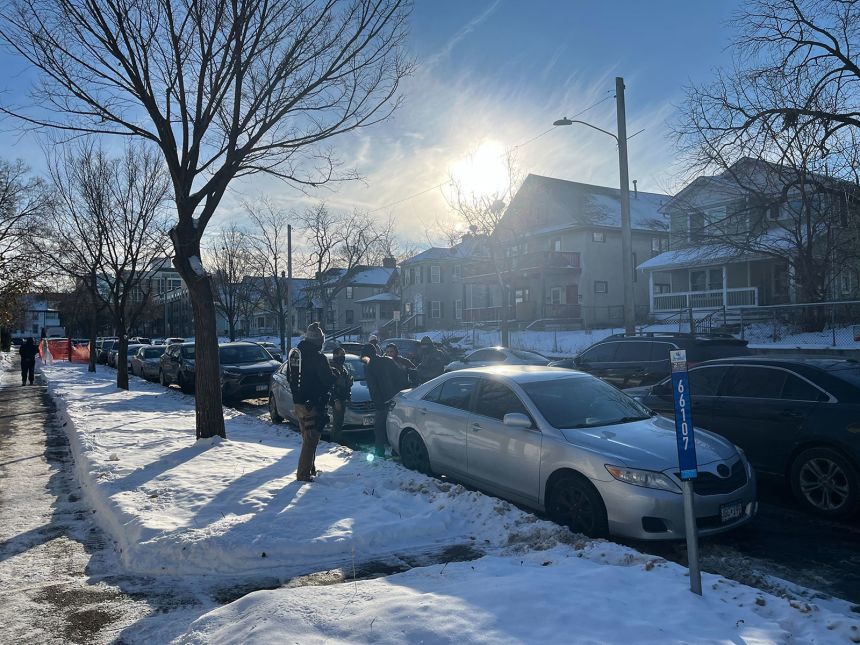 Armed agents approach a man to ask for identification outside a Minneapolis mall catering to Somali patrons in Minneapolis, Minnesota, on December 3, 2025.