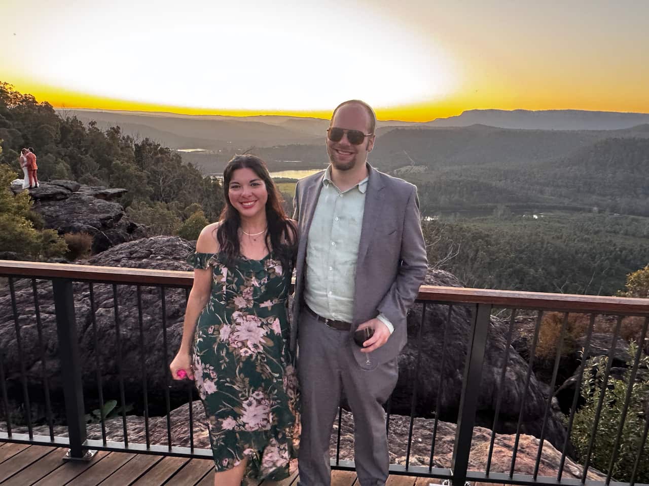 A couple posing at a scenic lookout