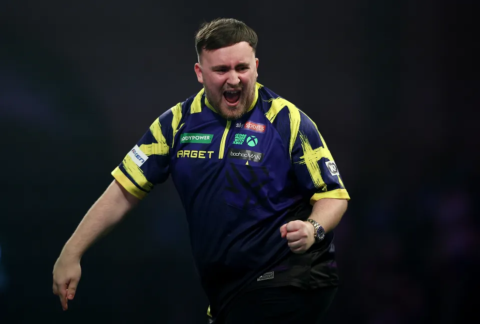 Luke Littler reacts during his clash with Rob Cross
