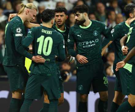 Manchester City players celebrating after scoring against Real Madrid in the UEFA Champions League