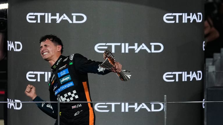 McLaren driver Lando Norris of Britain celebrates after becoming a world champion after the Formula One Abu Dhabi Grand Prix.