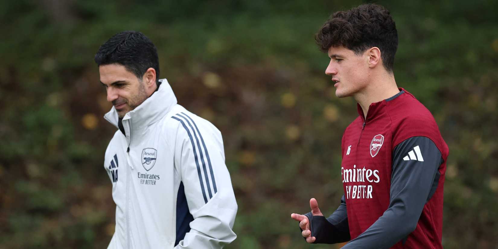 Arsenal manager Mikel Arteta and Christian Norgaard walk to training.