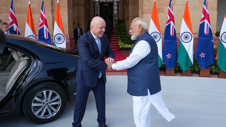 New Zealand Prime Minister Christopher Luxon and India Prime Minister Narendra Modi shake hands in India in March 2025 when negotiations were launched. 