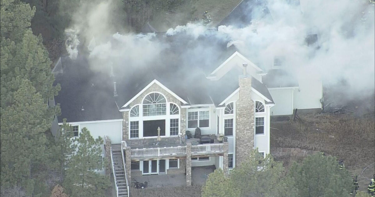 Colorado firefighters rush to put out garage fire that spread to home in Franktown