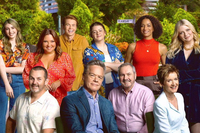 The cast of Neighbours; Karl, Paul, Susan, Terese, Toadie, Cara, Remi, Reece, Mackenzie and Byron, looking into camera on Ramsay Street in 2023.