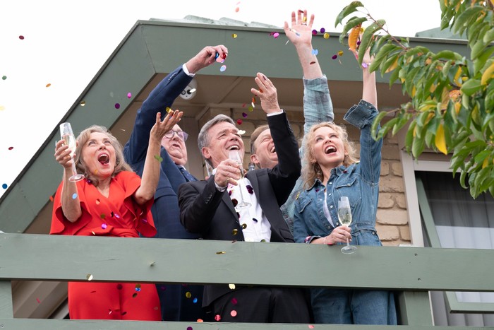 Jane, Paul, Harold, Scott and Charlene catching confetti in the finale of Neighbours