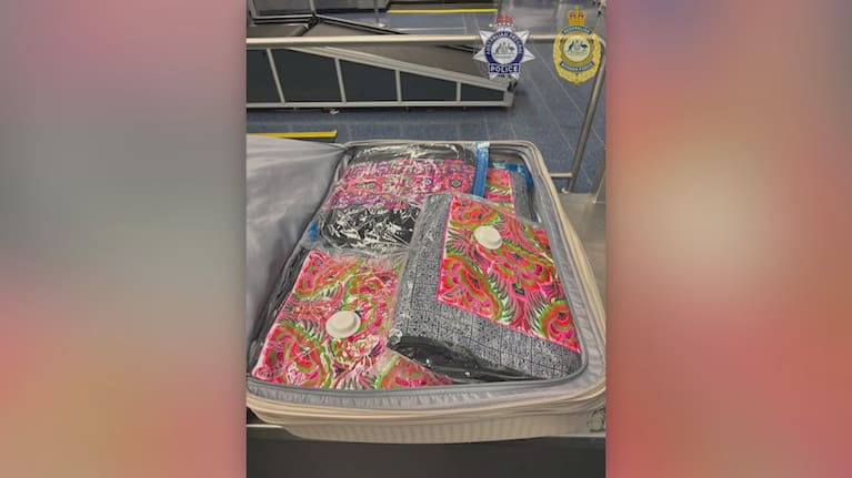 Officers searched two suitcases belonging to the man and allegedly found 21 floral-patterned, vacuum sealed bags containing a white powdery substance. 