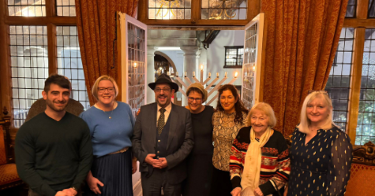 Menorah lit on Guildford balcony as a symbol of pluralism and religious liberty in a town