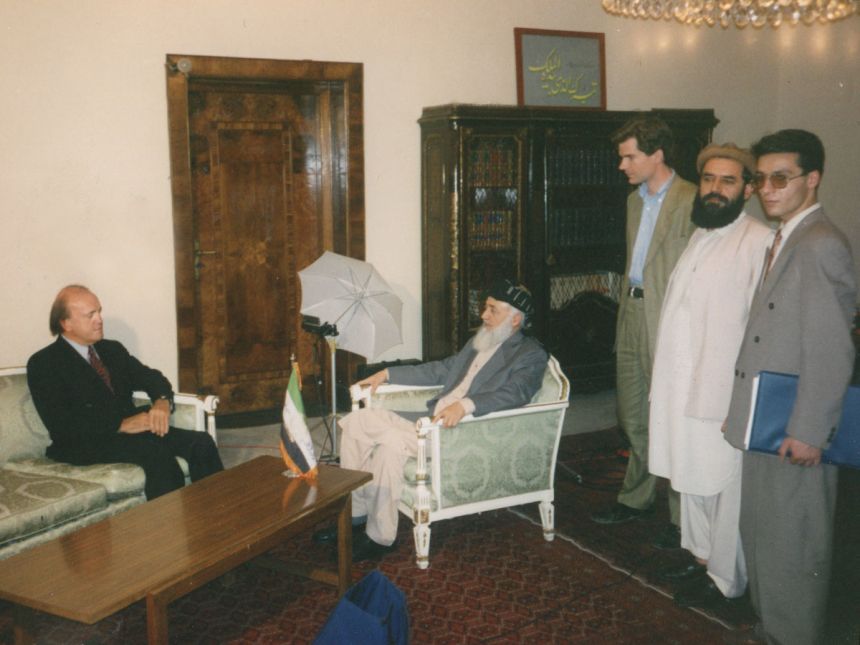 Peter Arnett, left, and Peter Bergen, third from right, meet with Afghan President Burhanuddin Rabbani, in Afghanistan in 1993.