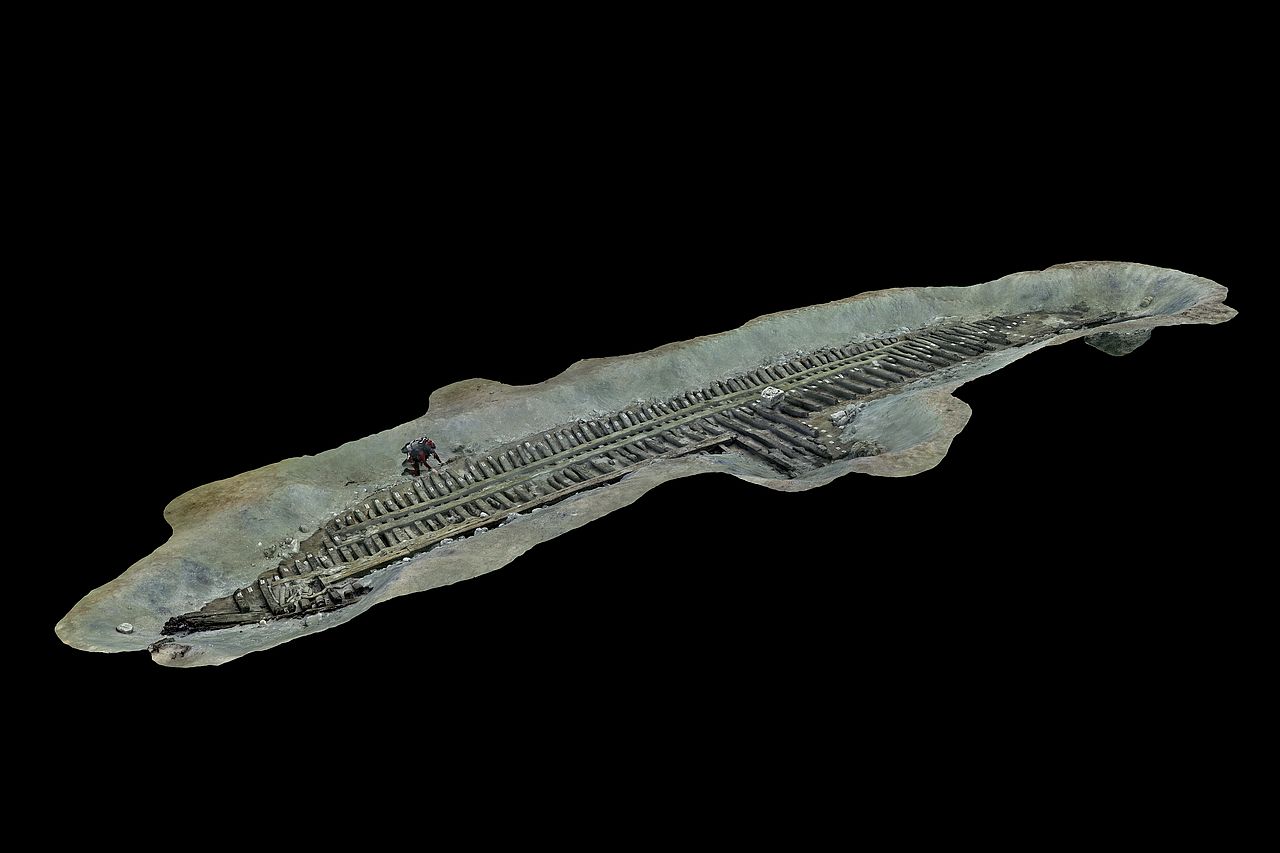 A 3D model in grey of a shipwreck on the sea floor