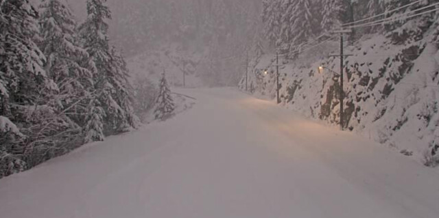 Snow covers Highway 1 near Hells Gate on Friday evening.
