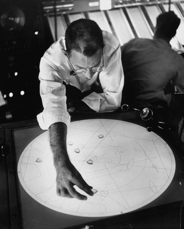 Aeronautical engineer Harry Barnes shows positions of suspected flying saucers near National Airport in Washington, DC, in July 1952.
