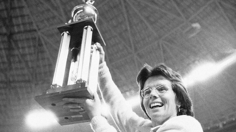 Billie Jean King holds the winner's trophy after beating Bobby Riggs. Pic: AP