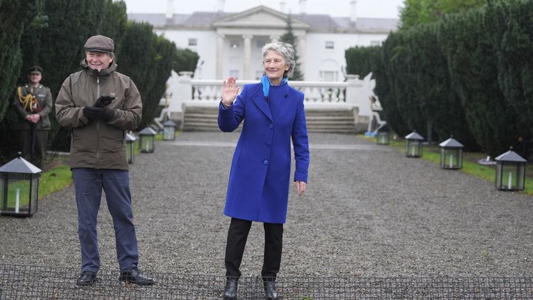 President Catherine Connolly and her husband Brian McEnery cheer the runners. Pic: PA