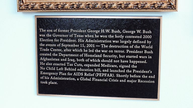 Bush's plaque attacks the wars in Iraq and Afghanistan. Pic: Reuters