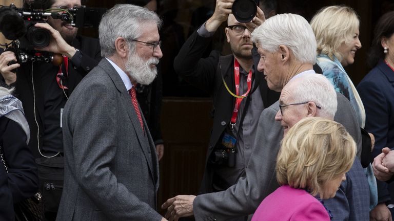 Adams and Clinton greet each other in 2023 at Queen's University Belfast. Pic: PA