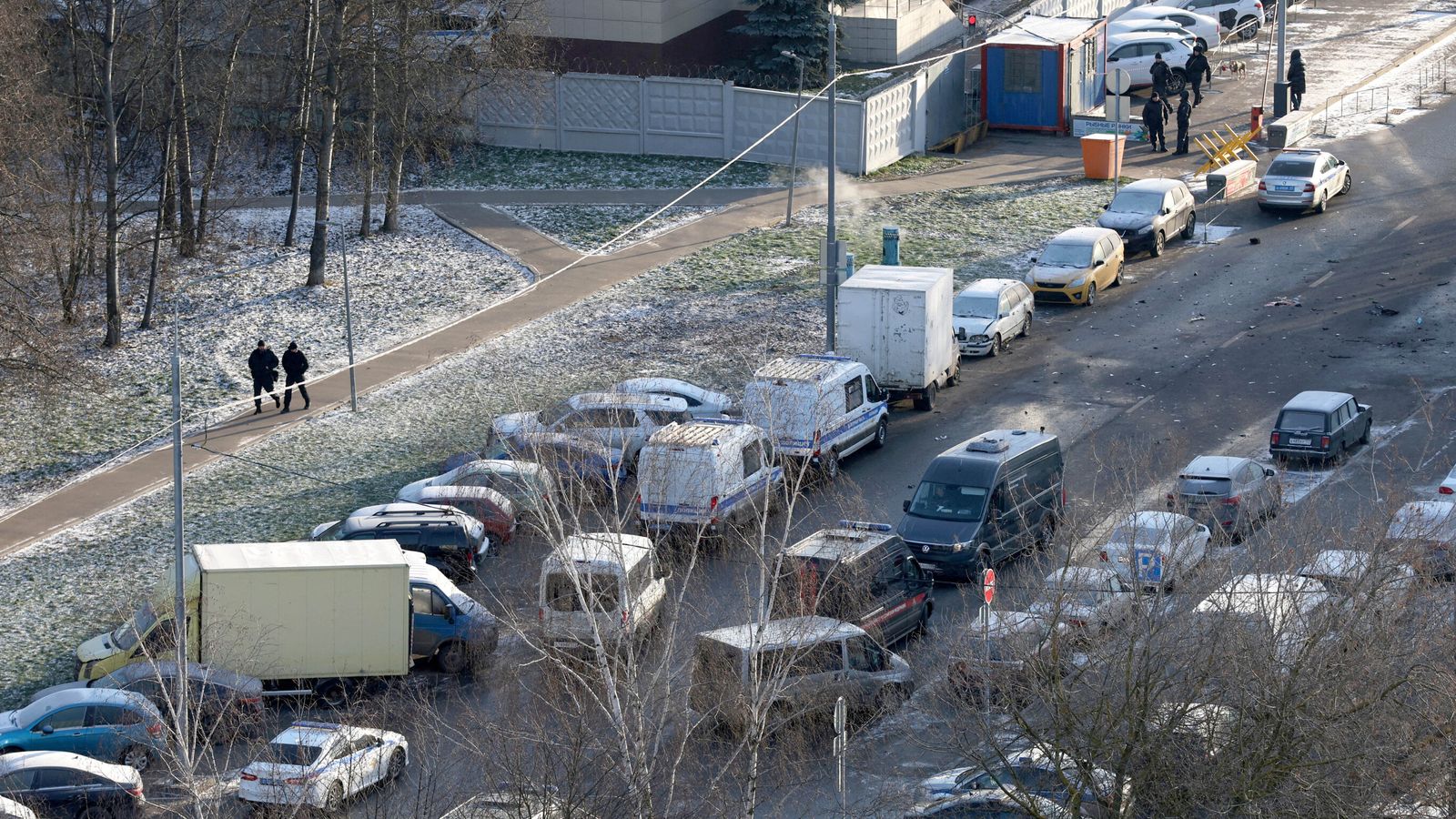 Officers at the scene where two police officers and another person were killed. Pic: Reuters/Ramil Sitdikov