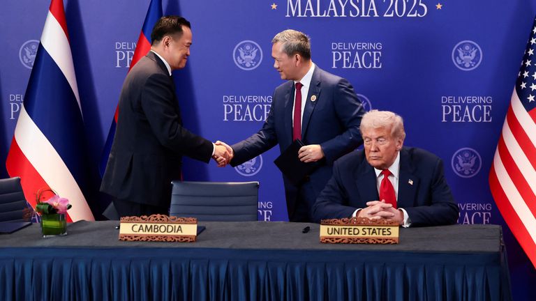 Thailand's Prime Minister Anutin Charnvirakul and Cambodia's Prime Minister Hun Manet shake hands next to US President Donald Trump in October. Pic: Reuters