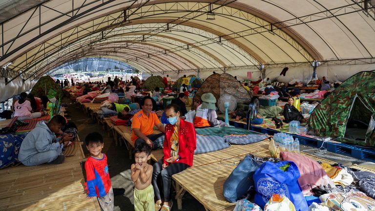 People rest at a shelter in Buriram province, Thailand, after fresh military clashes. Pic: Reuters