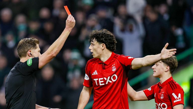 Aberdeen's Dylan Lobban (R) is shown a red card for a foul on Celtic's Daizen Maeda