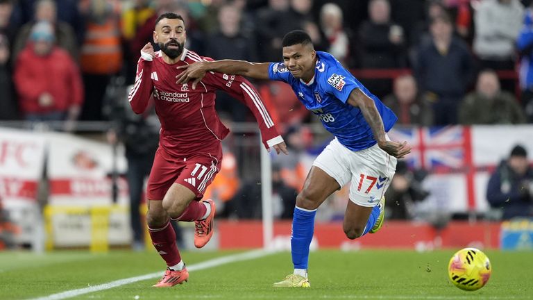 Liverpool's Mohamed Salah (left) and Sunderland's Reinildo Mandava in action