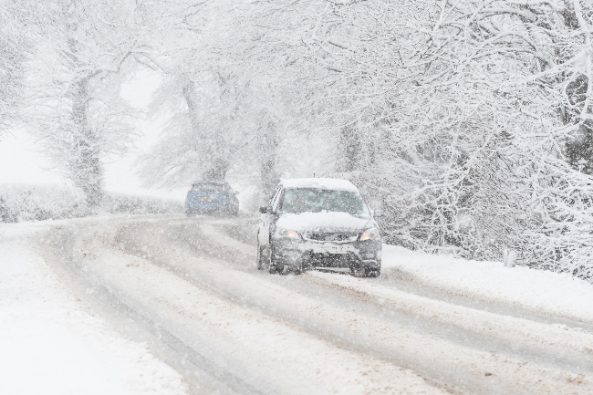 Snowy road and car