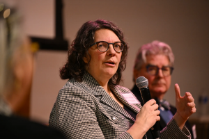 Woman speaking into microphone