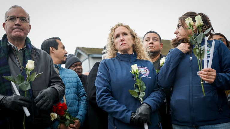Stockton Mayor Christina Fugazi joins a vigil near the site at Thornton Blvd. and Lucile Ave., where a mass shooting took place Saturday at a banquet hall in Stockton.