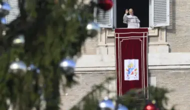 Pope Leo XIV greets pilgrims gathered in St. Peter’s Square at the Vatican for the recitation of the Angelus on Dec. 21, 2025.