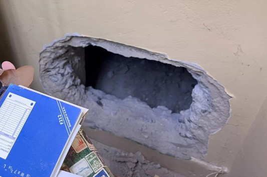 Burglars tunneled through a wall to gain access to the store.