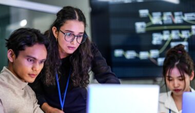 young professionals looking at a computer screen