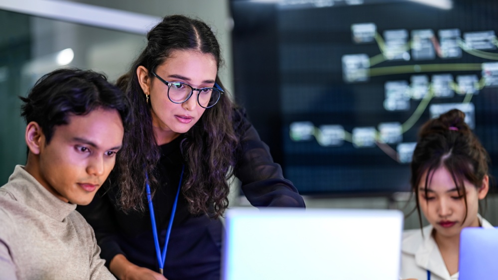 young professionals looking at a computer screen