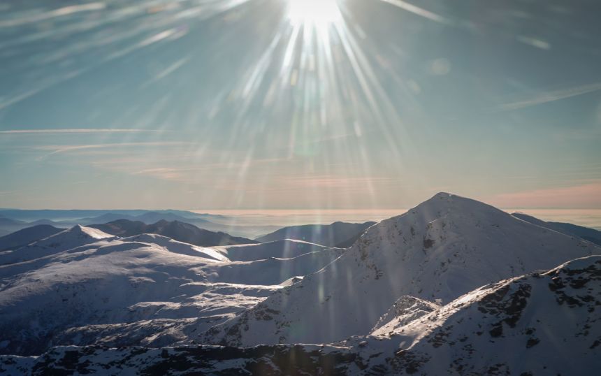 An aerial view over the Carpathian Mountains, a range extending through several European countries.
