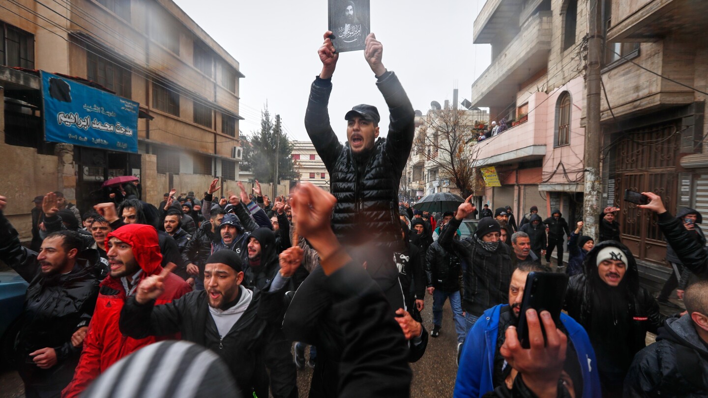 Mourners gather at Syria's Homs mosque for victims of deadly bombing