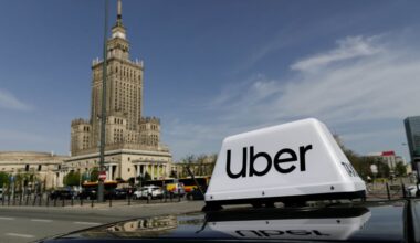 Uber logo on top of car.