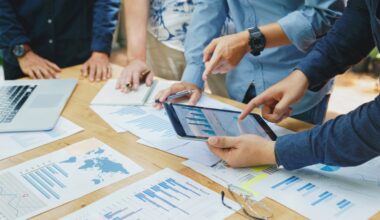 Workers collaborating around a tablet.