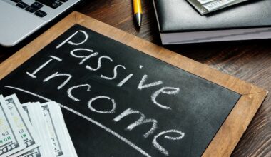 "Passive Income" written on a chalkboard with money sitting on top.