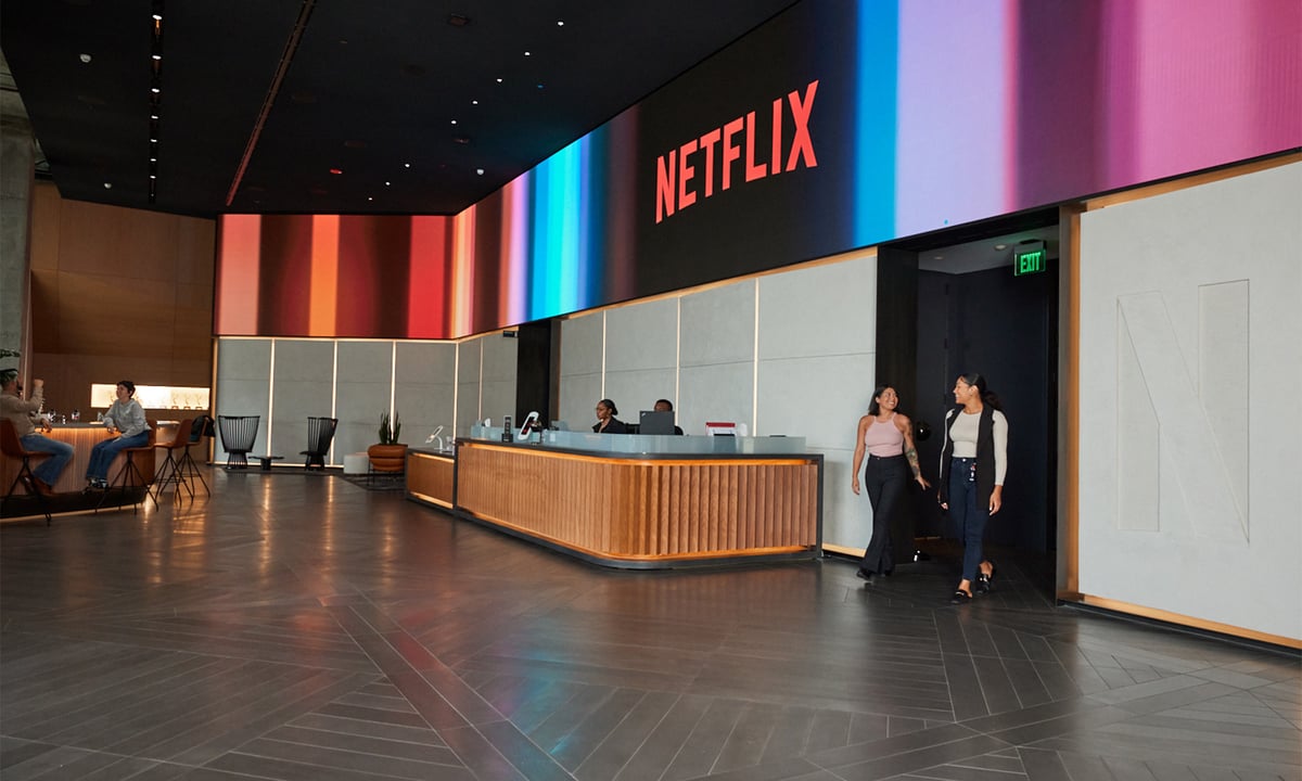 A Netflix lobby with two people walking out of a doorway.