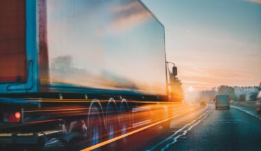 Truck driving down a highway.