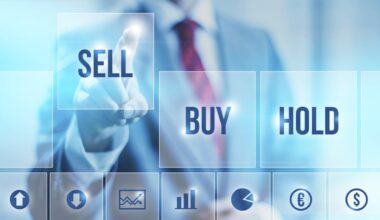 A businessperson pressing the sell button on an oversized digital screen.