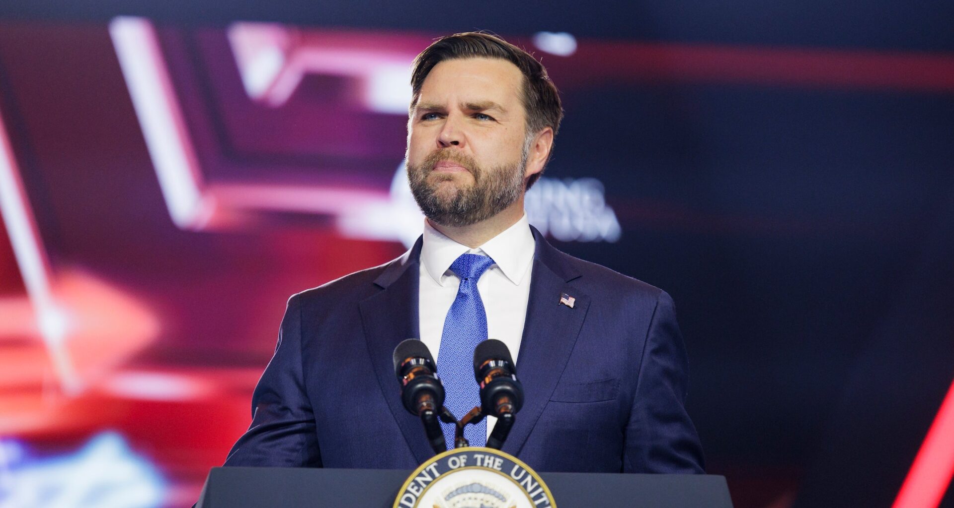 A photo of vance speaking at a podium.