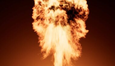 A large explosion of smoke is coming out of a bottle