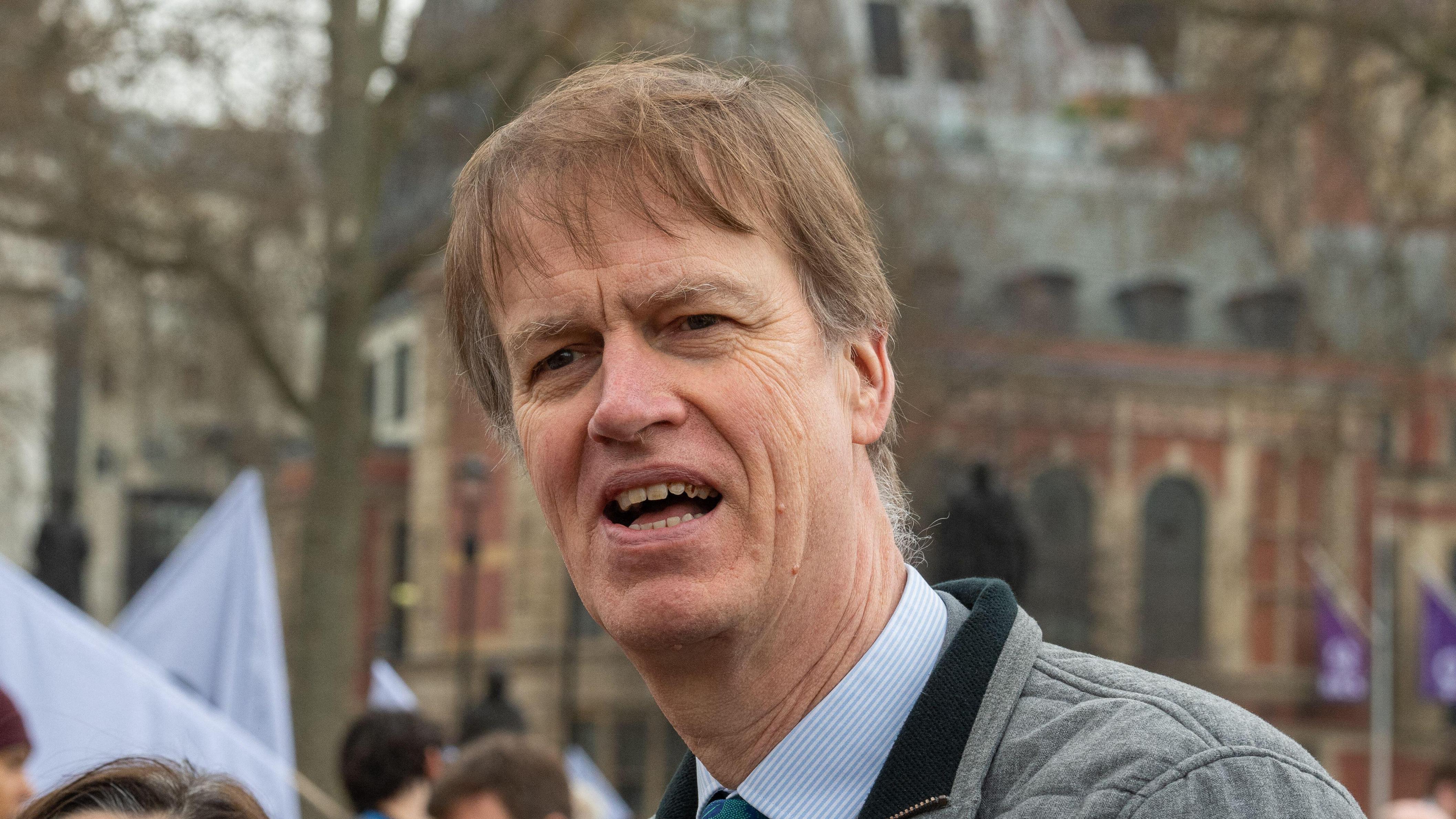 Stephen Timms speaking at a protest.